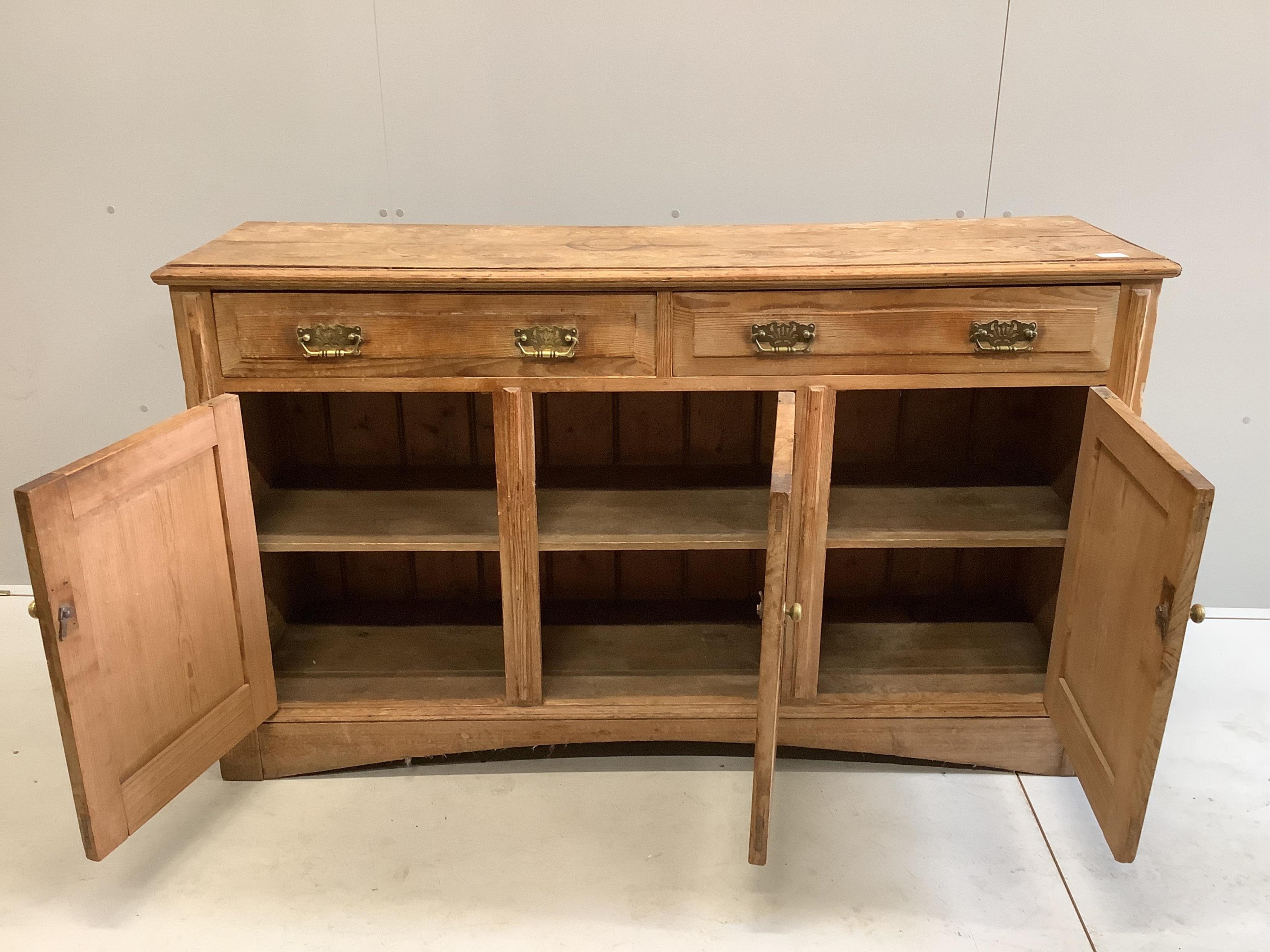A late Victorian pitch pine low dresser, width 155cm, depth 43cm, height 92cm. Condition - poor